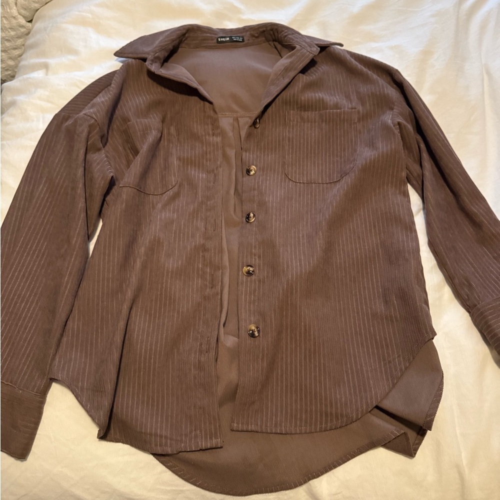 Small brown button down shirt.